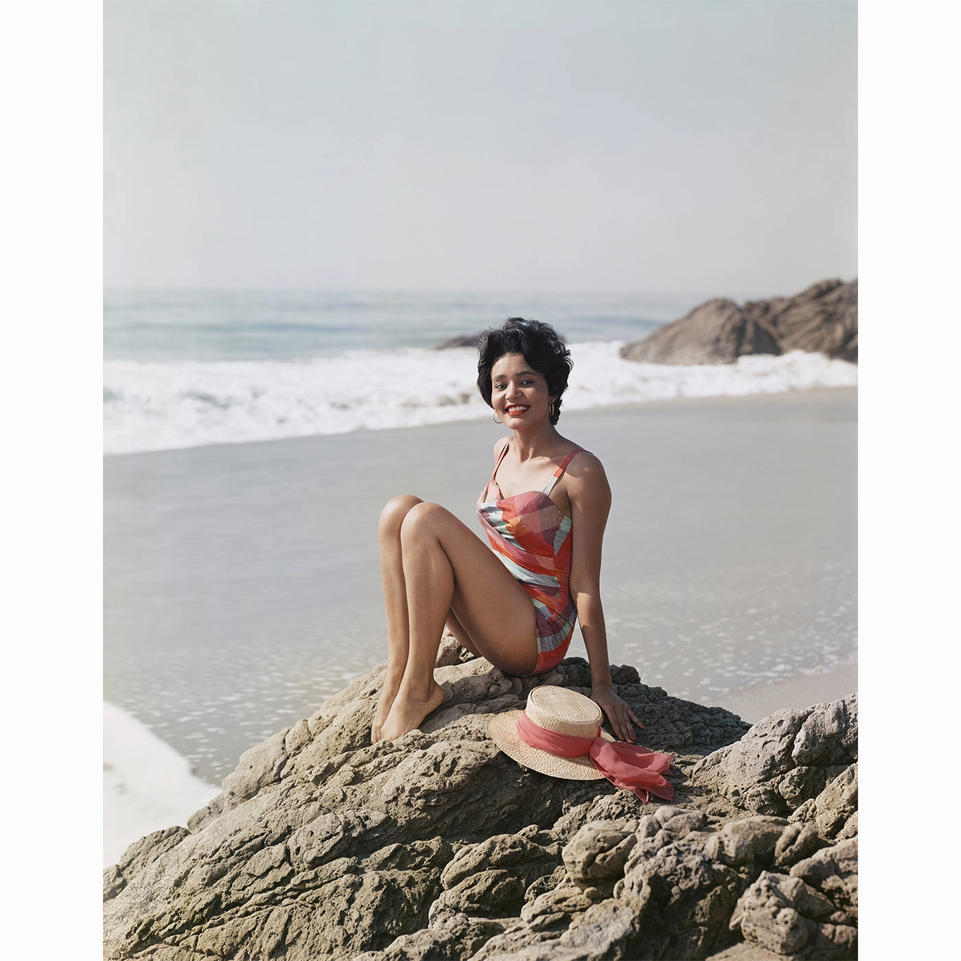 "Young Woman Sitting Beside the Sea" from Getty Imagesnordic style wall decor