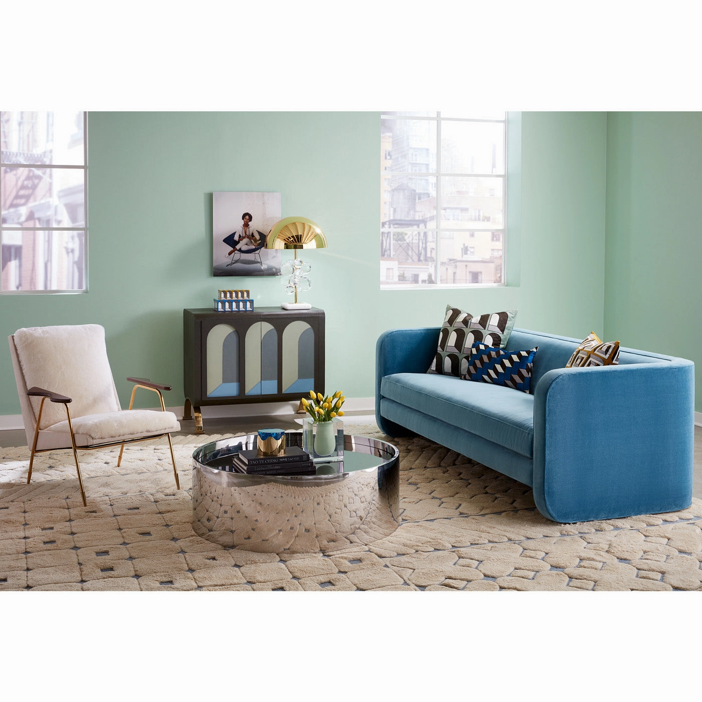 "Young Woman Sitting on Armchair" from Getty Images